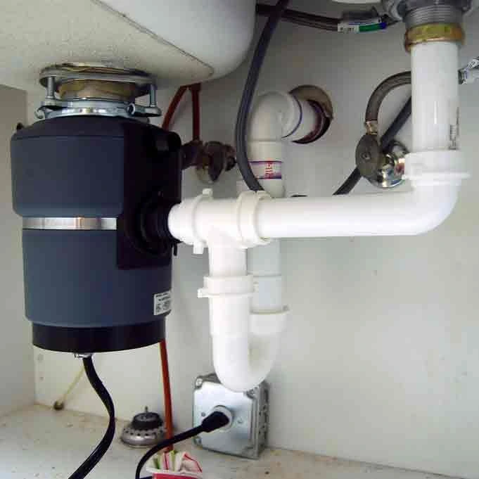 Denver plumber fixing jammed garbage disposal