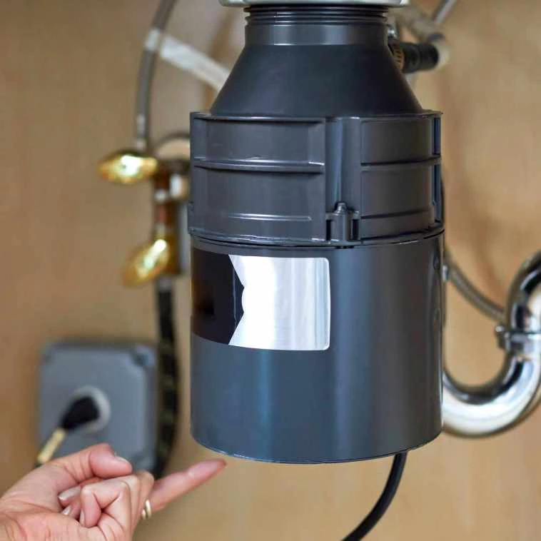 garbage disposal leak under kitchen sink Denver