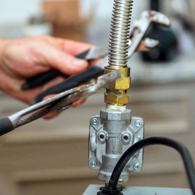 Denver plumber repairing a leaking gas line